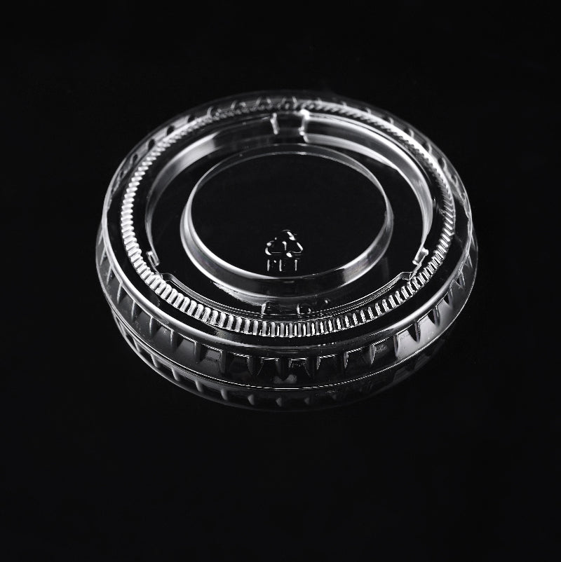 A PET cup lid with recycle symbol