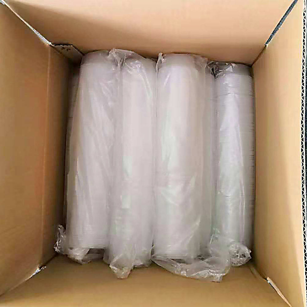 Multiple PET caps packaged in clear PE bags, neatly arranged inside a corrugated cardboard box awaiting final packaging